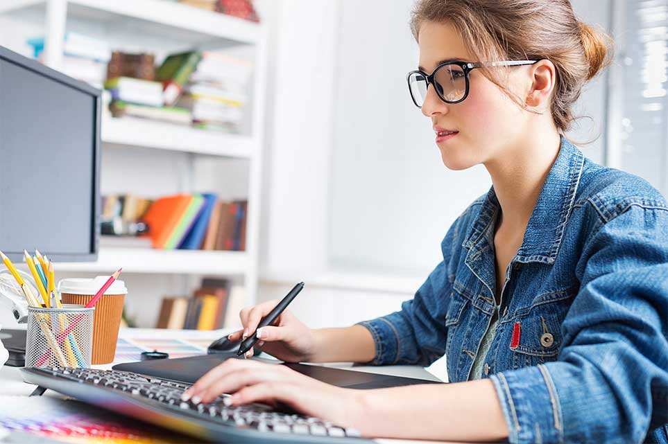 Student reviewing notes while working at a desk